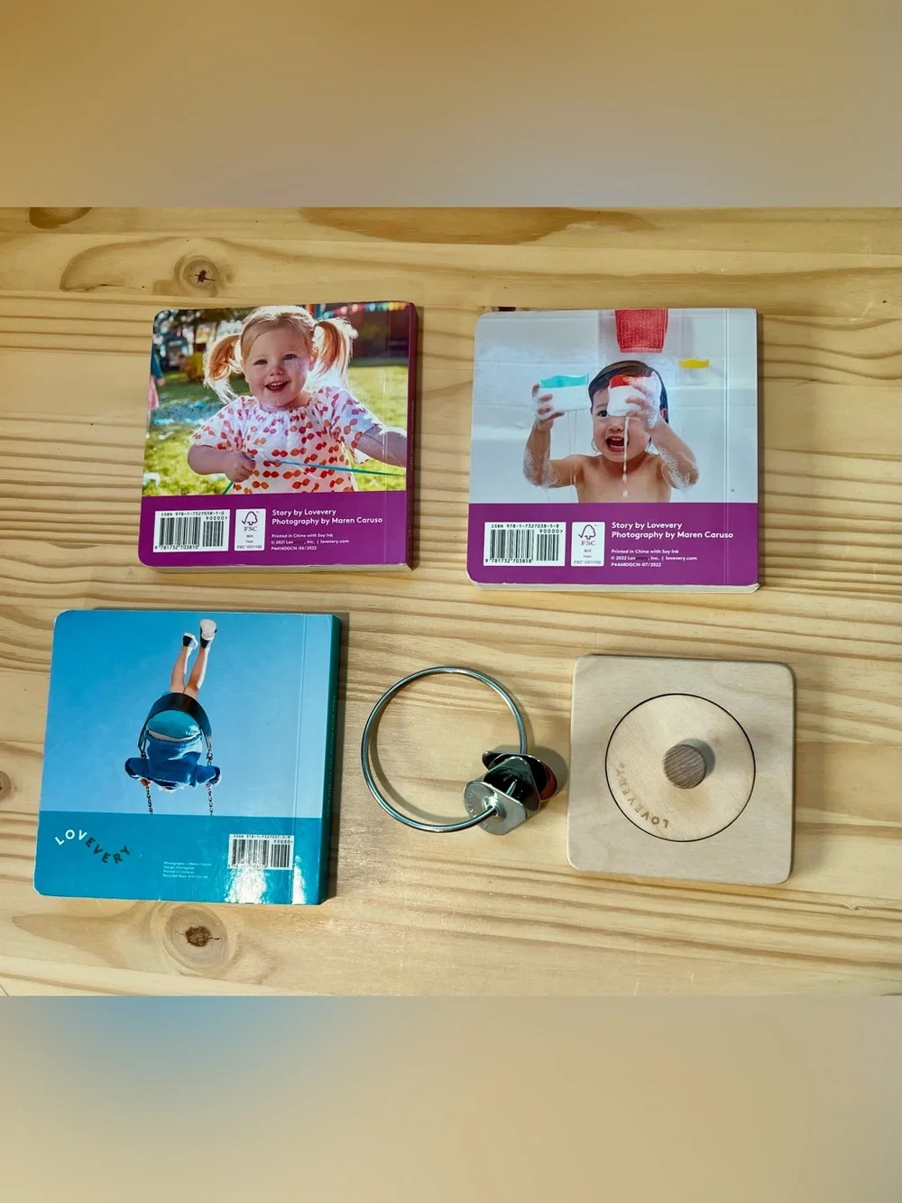 Lovevery books, puzzle and dangle toy